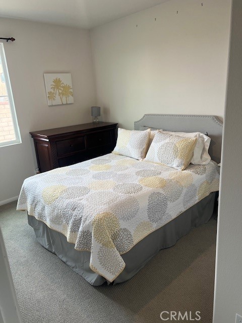 29901 Bridlegate Way Menifee, CA 92584 - Photo 22 of 43 a large bed sitting in a bedroom next to a window
