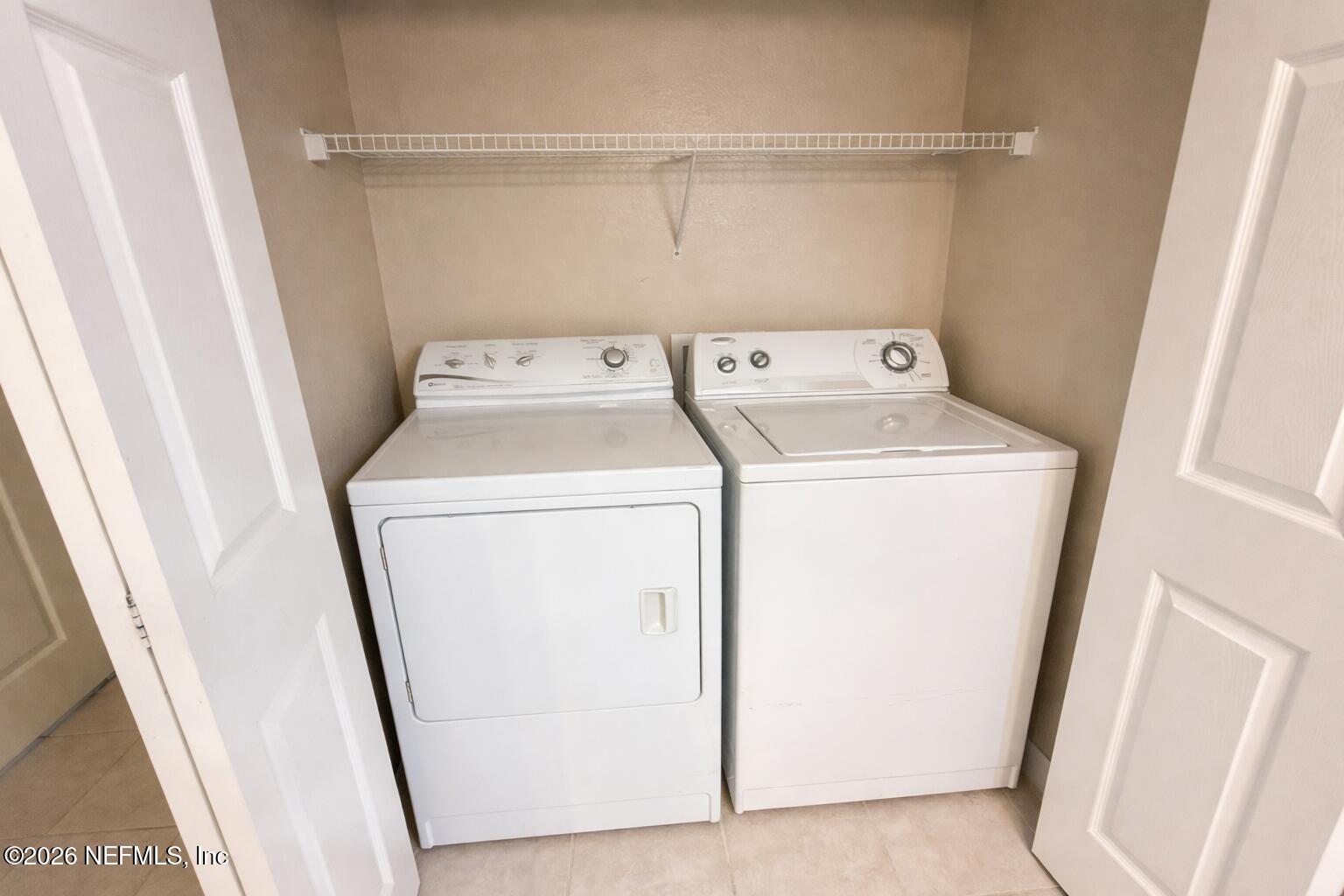 10961 Burnt Mill Road, Unit 225 Jacksonville, FL 32256 - Photo 7 of 17 a utility room with dryer and washer