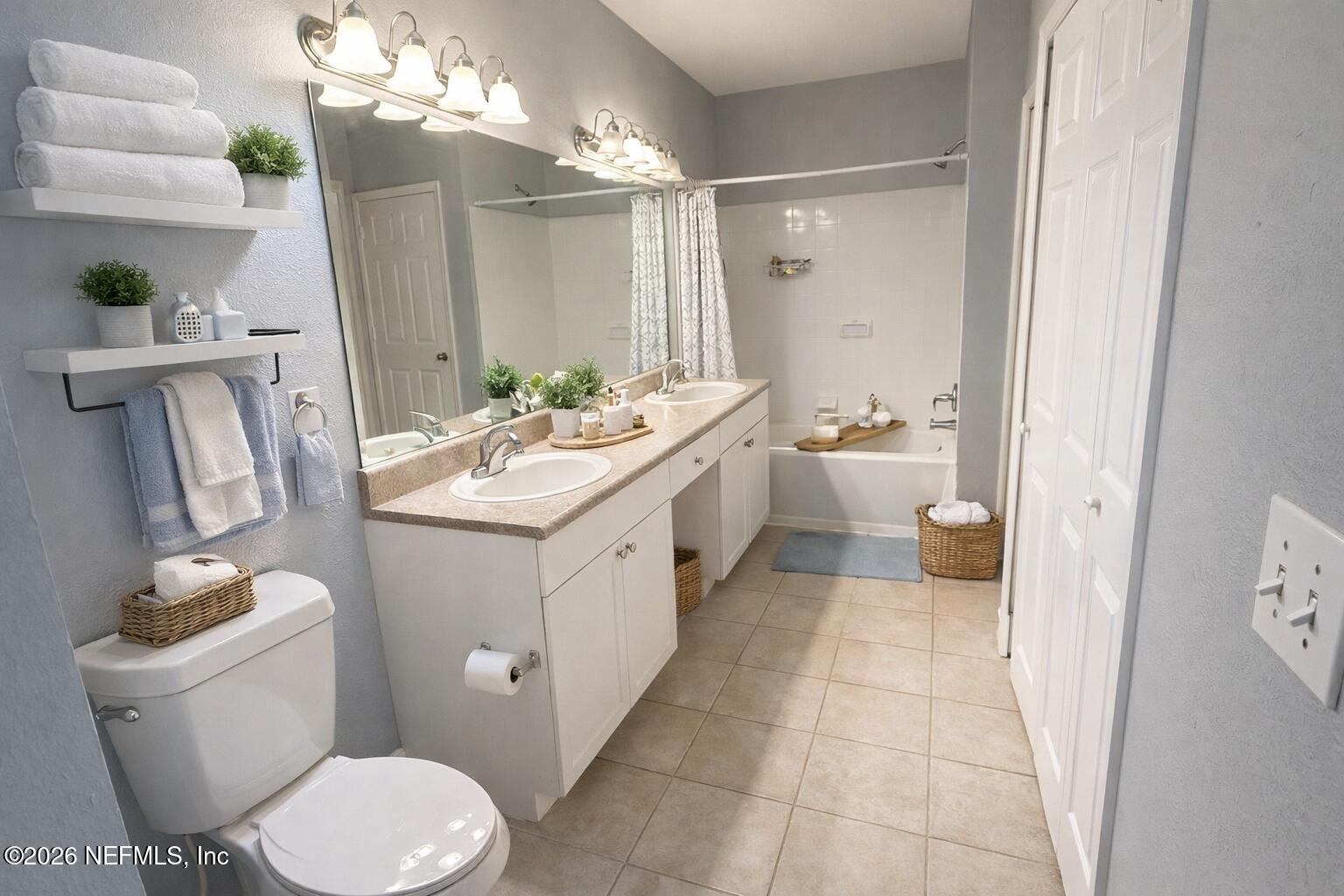 10961 Burnt Mill Road, Unit 225 Jacksonville, FL 32256 - Photo 8 of 17 a bathroom with a sink vanity granite toilet and a mirror