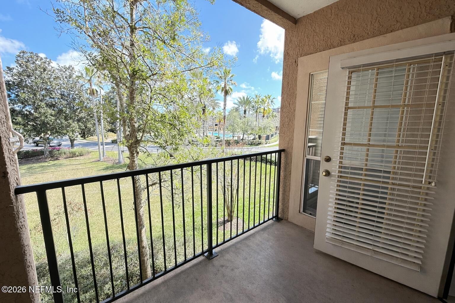 10961 Burnt Mill Road, Unit 225 Jacksonville, FL 32256 - Photo 9 of 17 a view of a balcony with an outdoor space
