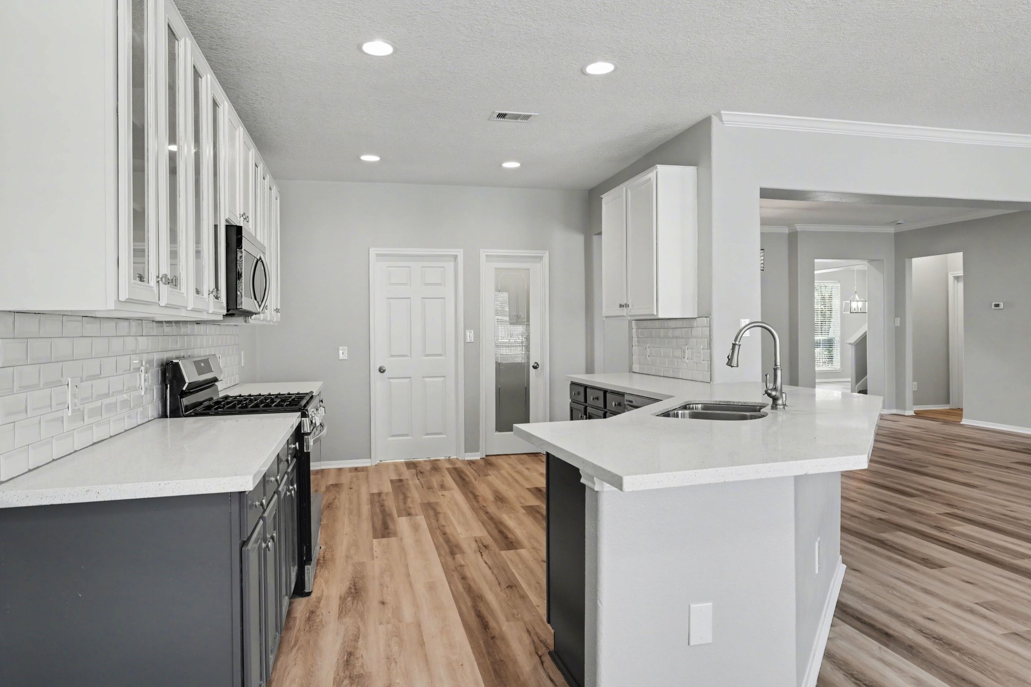 22310 Lamaster Lane Spring, TX 77373 - Photo 16 of 48 The kitchen has plenty of cabinet and countertop space for all your family needs.