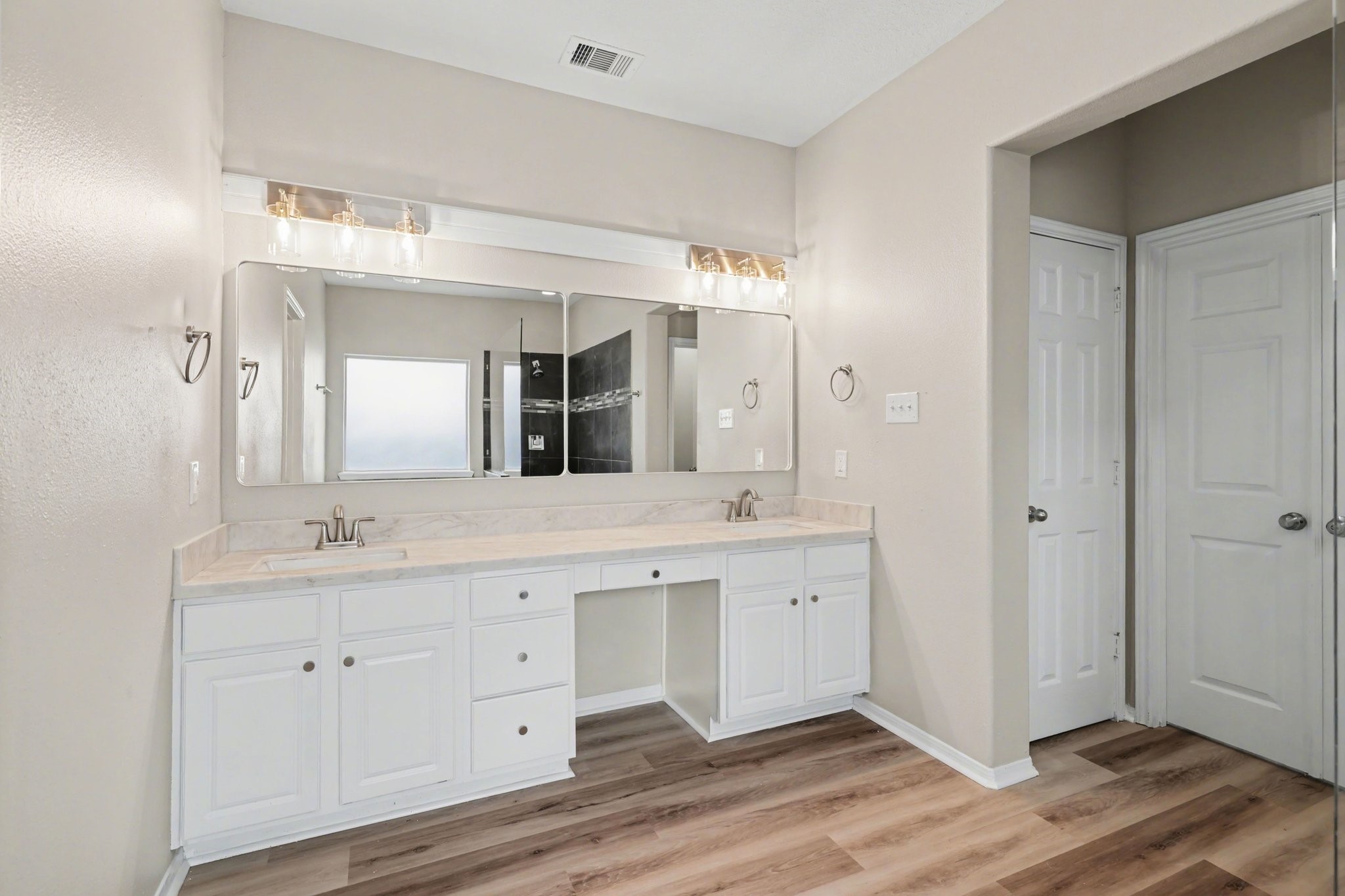 22310 Lamaster Lane Spring, TX 77373 - Photo 29 of 48 Dual sink with vanity area in the primary bathroom downstairs.