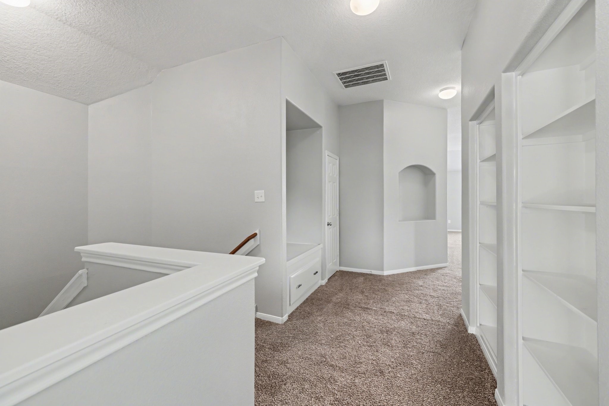 22310 Lamaster Lane Spring, TX 77373 - Photo 30 of 48 Once upstairs you'll find a variety of storage including bookshelves and a small reading nook on the left.