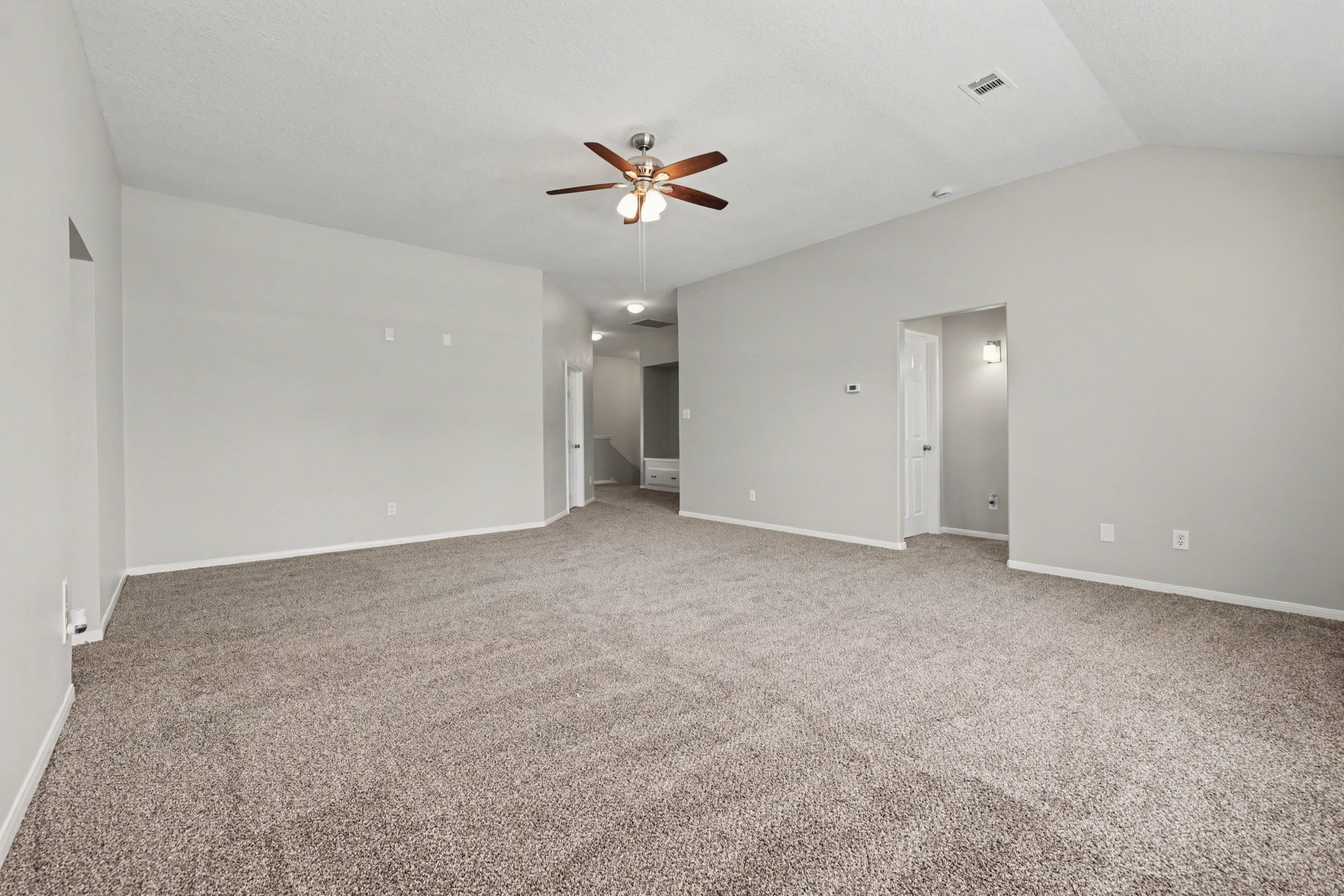 22310 Lamaster Lane Spring, TX 77373 - Photo 40 of 48 The hallway on the right hosts two secondary bedrooms with a full bathroom situted between. Easy access for the game room.