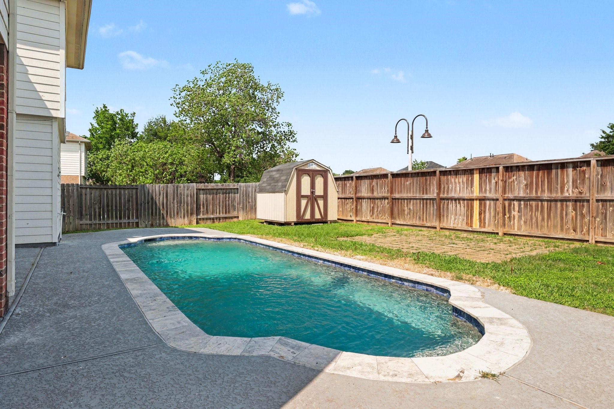 22310 Lamaster Lane Spring, TX 77373 - Photo 45 of 48 Picture the summer months with time spent here! Storage shed is approx. 7'x7'