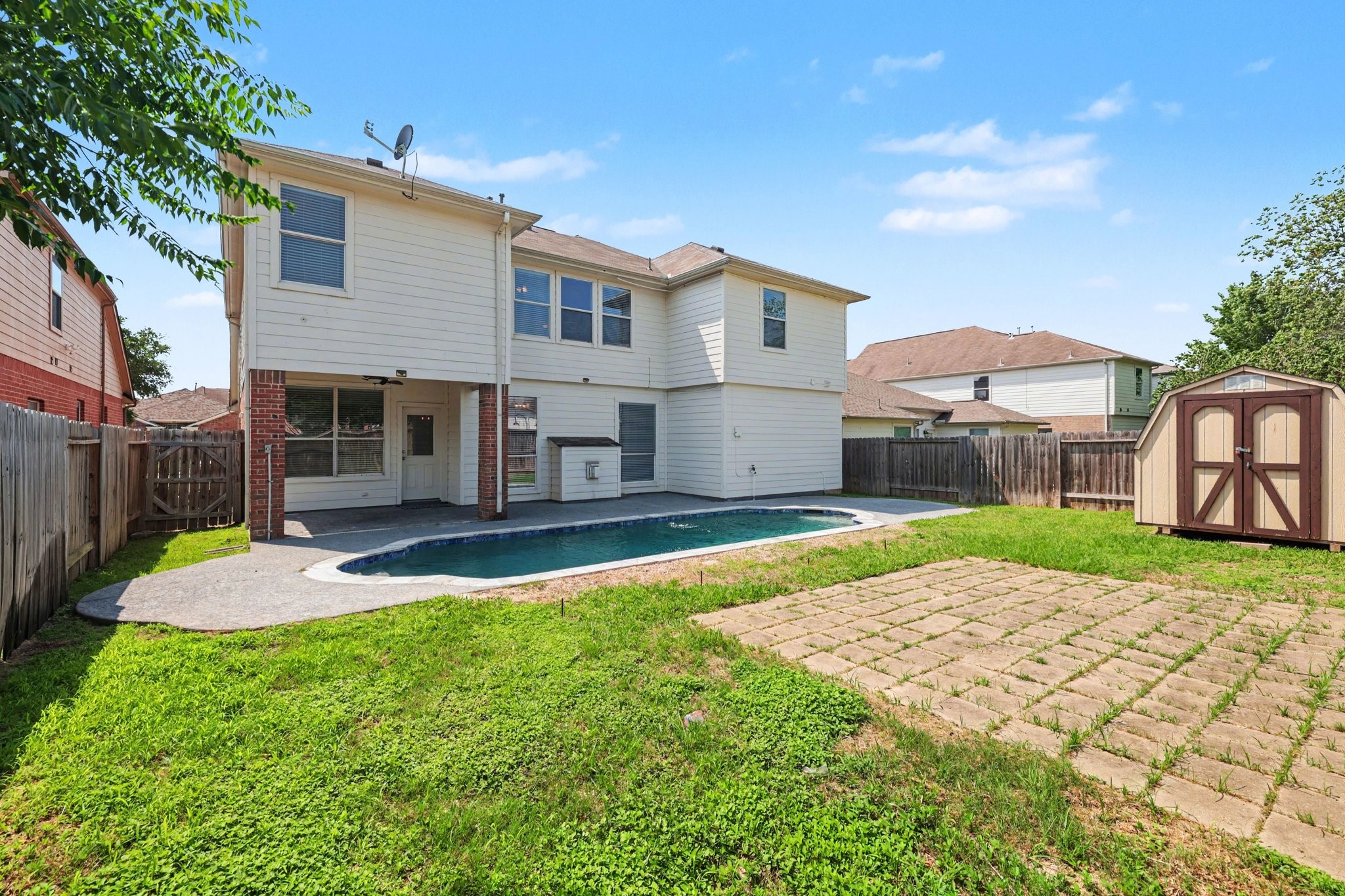 22310 Lamaster Lane Spring, TX 77373 - Photo 46 of 48 A view from the back of the yard. Set up an outdoor living space with umbrella on the pavers and you're set!