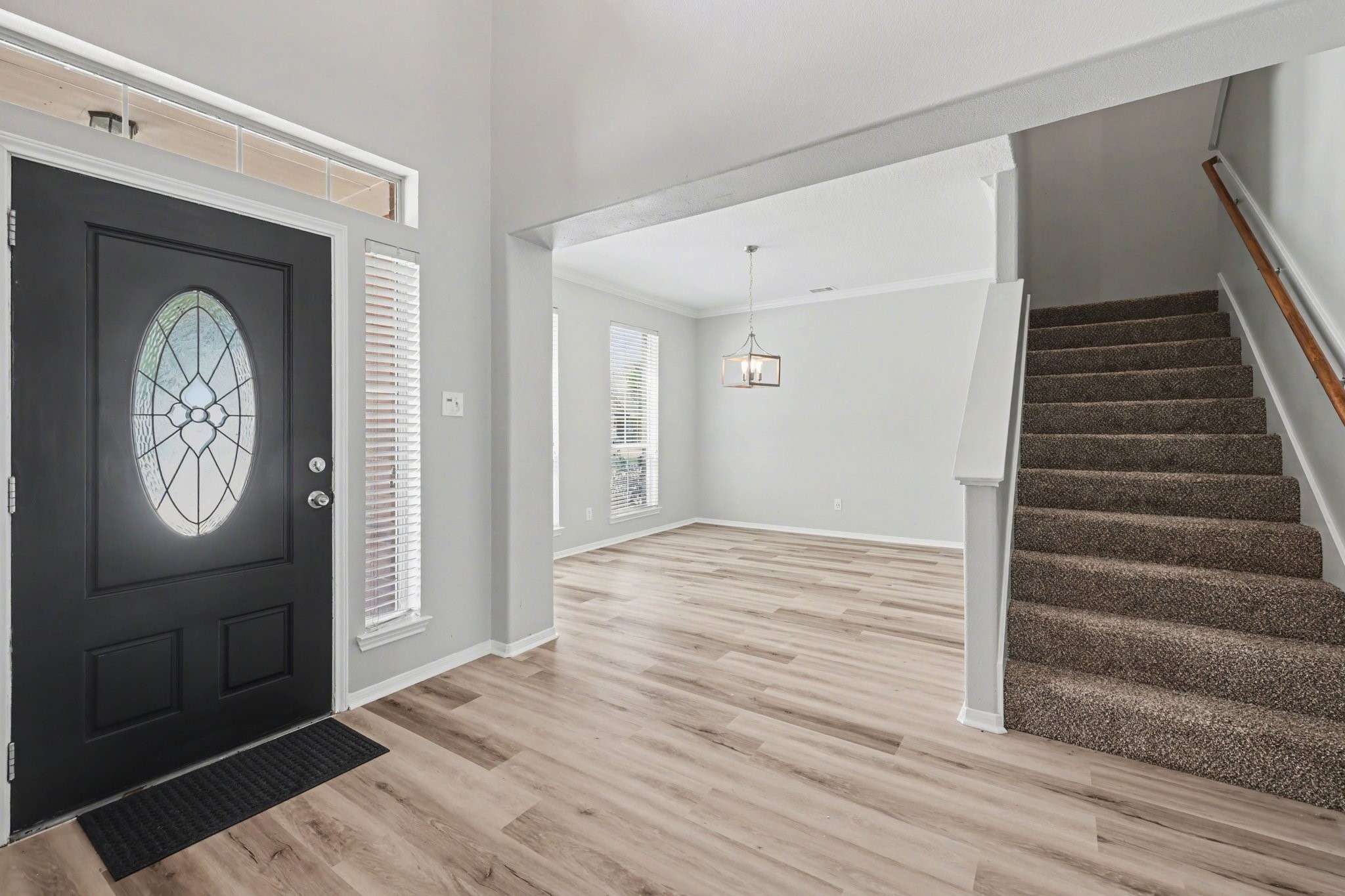 22310 Lamaster Lane Spring, TX 77373 - Photo 6 of 48 The entryway has a home office just inside, with carpeted stairs to the upper level.