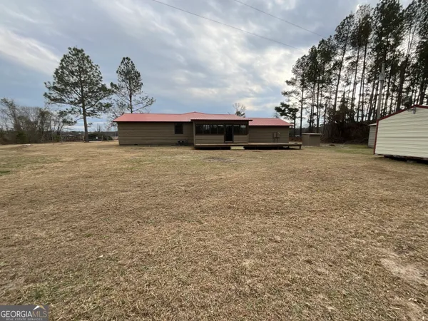 a backyard of a house with a yard and garage