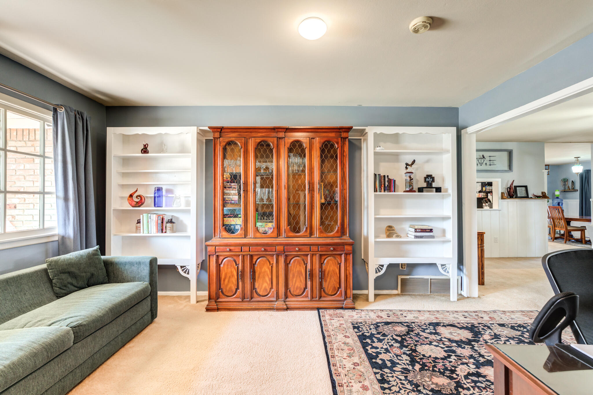 2132 69th Street Lubbock, TX 79412 - Photo 11 of 38 a living room with furniture or couch and a window