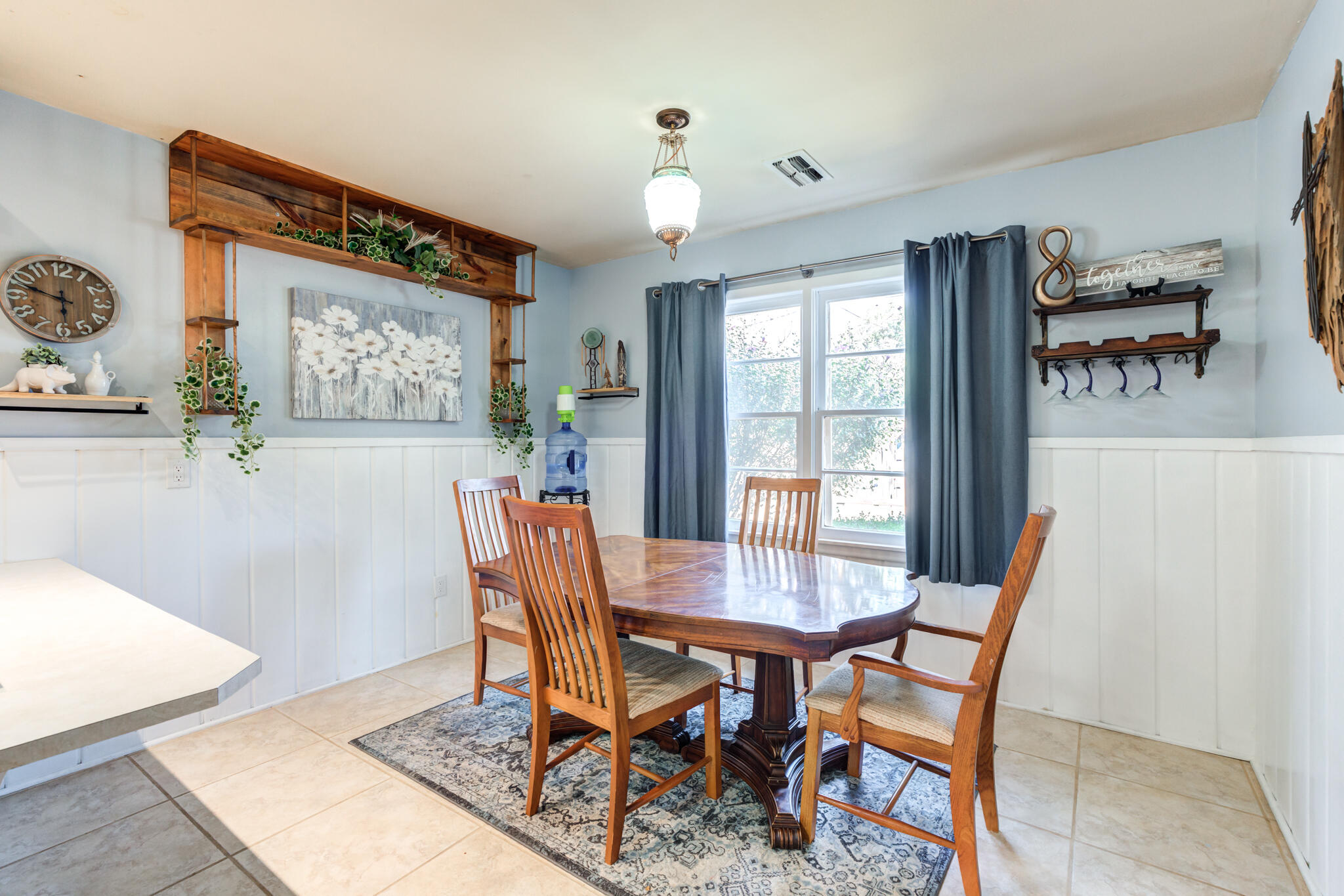 2132 69th Street Lubbock, TX 79412 - Photo 18 of 38 a view of a dining room with furniture window and wooden floor