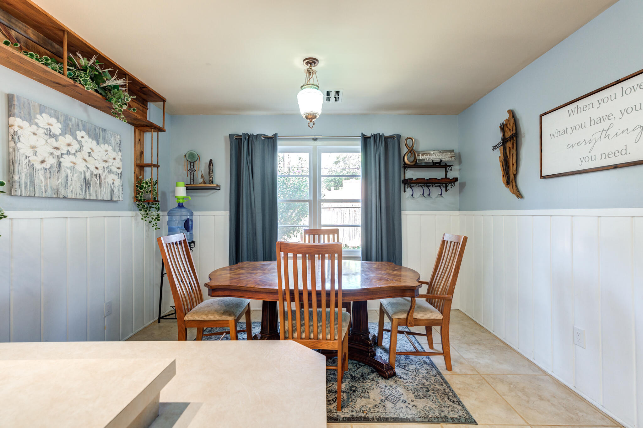 2132 69th Street Lubbock, TX 79412 - Photo 19 of 38 a view of a dining room with furniture window and outside view