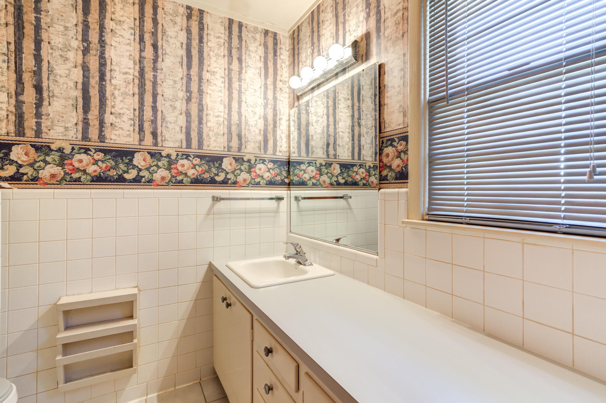 2132 69th Street Lubbock, TX 79412 - Photo 26 of 38 a bathroom with a sink and a window