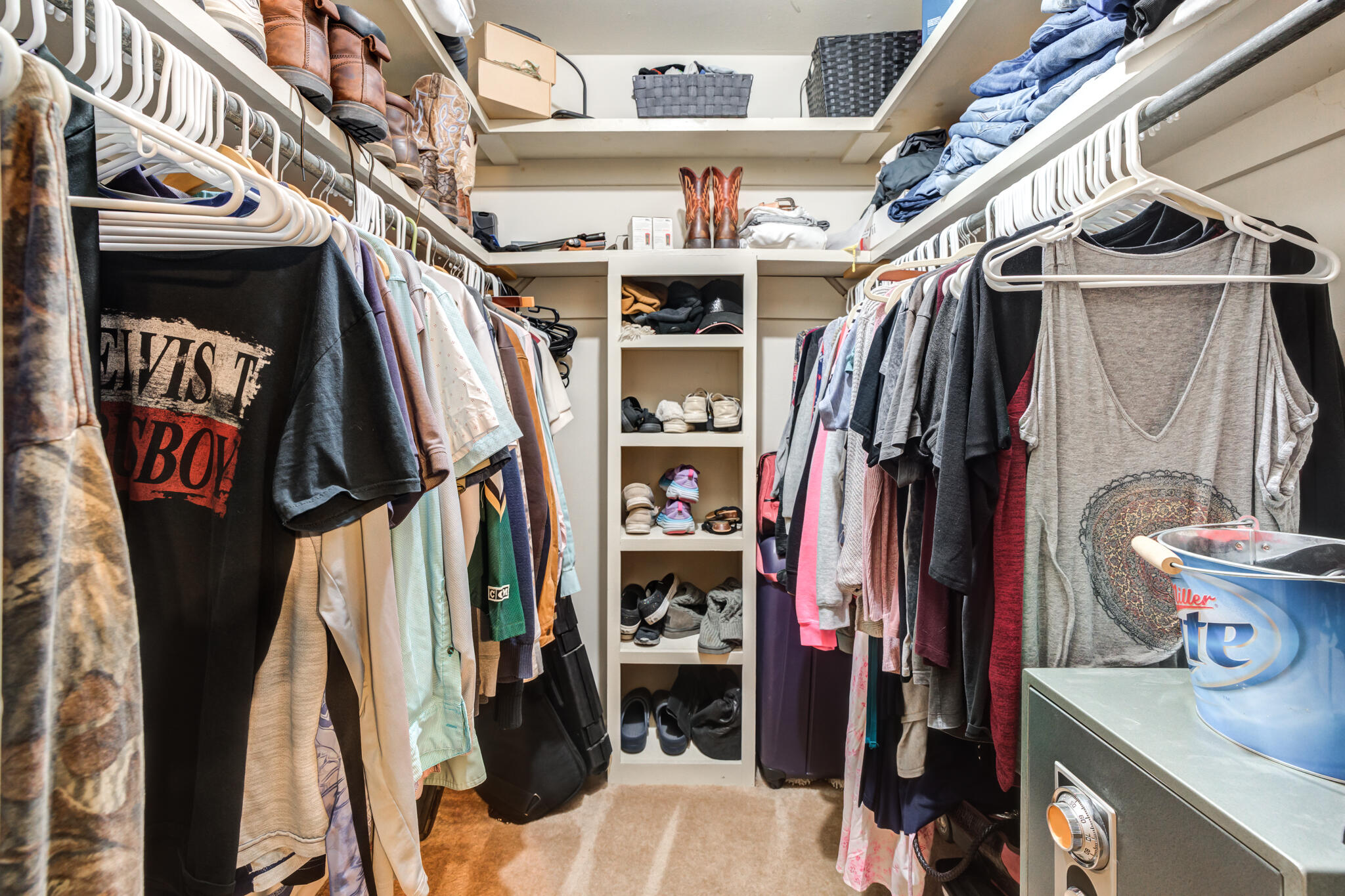 2132 69th Street Lubbock, TX 79412 - Photo 27 of 38 a view of walk in closet with clothes and shoes