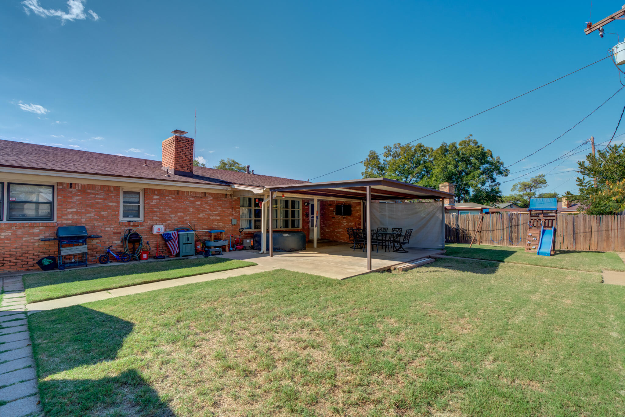 2132 69th Street Lubbock, TX 79412 - Photo 38 of 38 a view of a house with a yard and garage