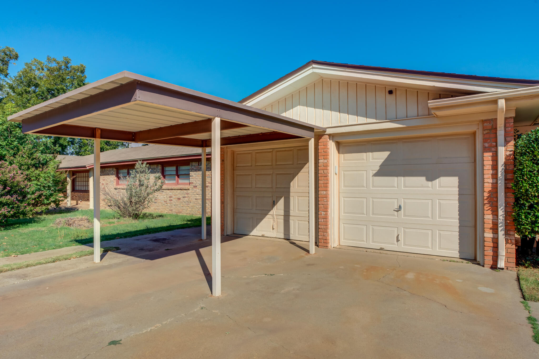 2132 69th Street Lubbock, TX 79412 - Photo 4 of 38 a front view of a house with garden