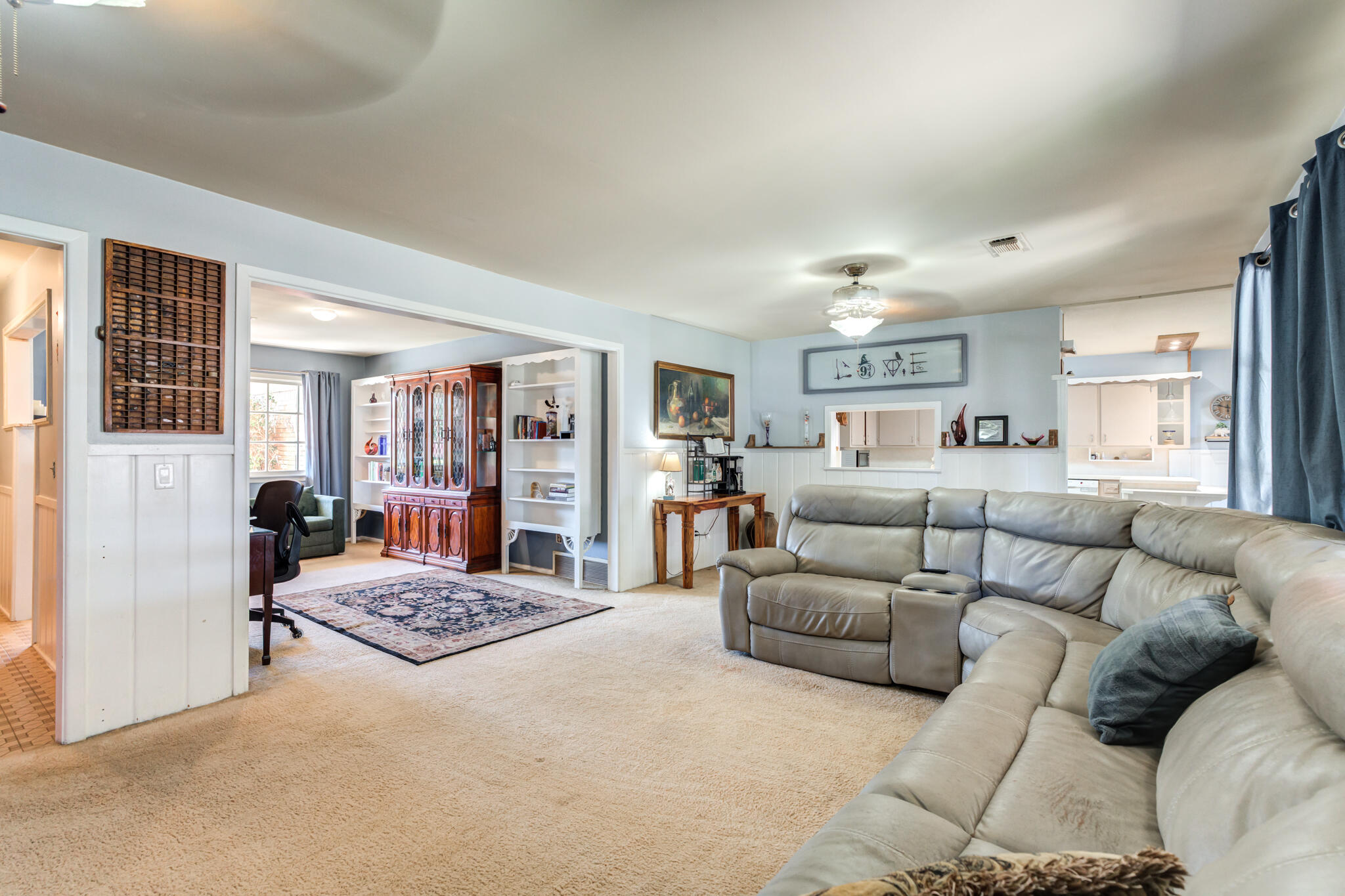 2132 69th Street Lubbock, TX 79412 - Photo 6 of 38 a living room with furniture and a couch