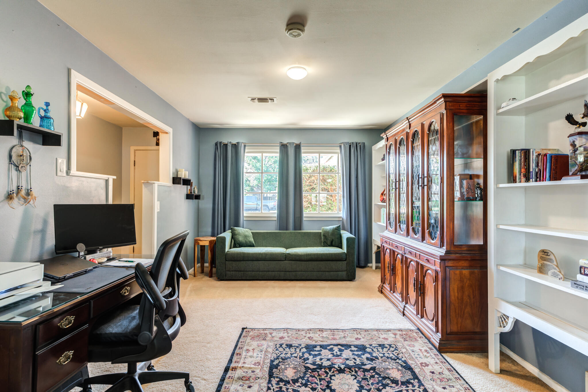 2132 69th Street Lubbock, TX 79412 - Photo 9 of 38 a livingroom with workspace and a window