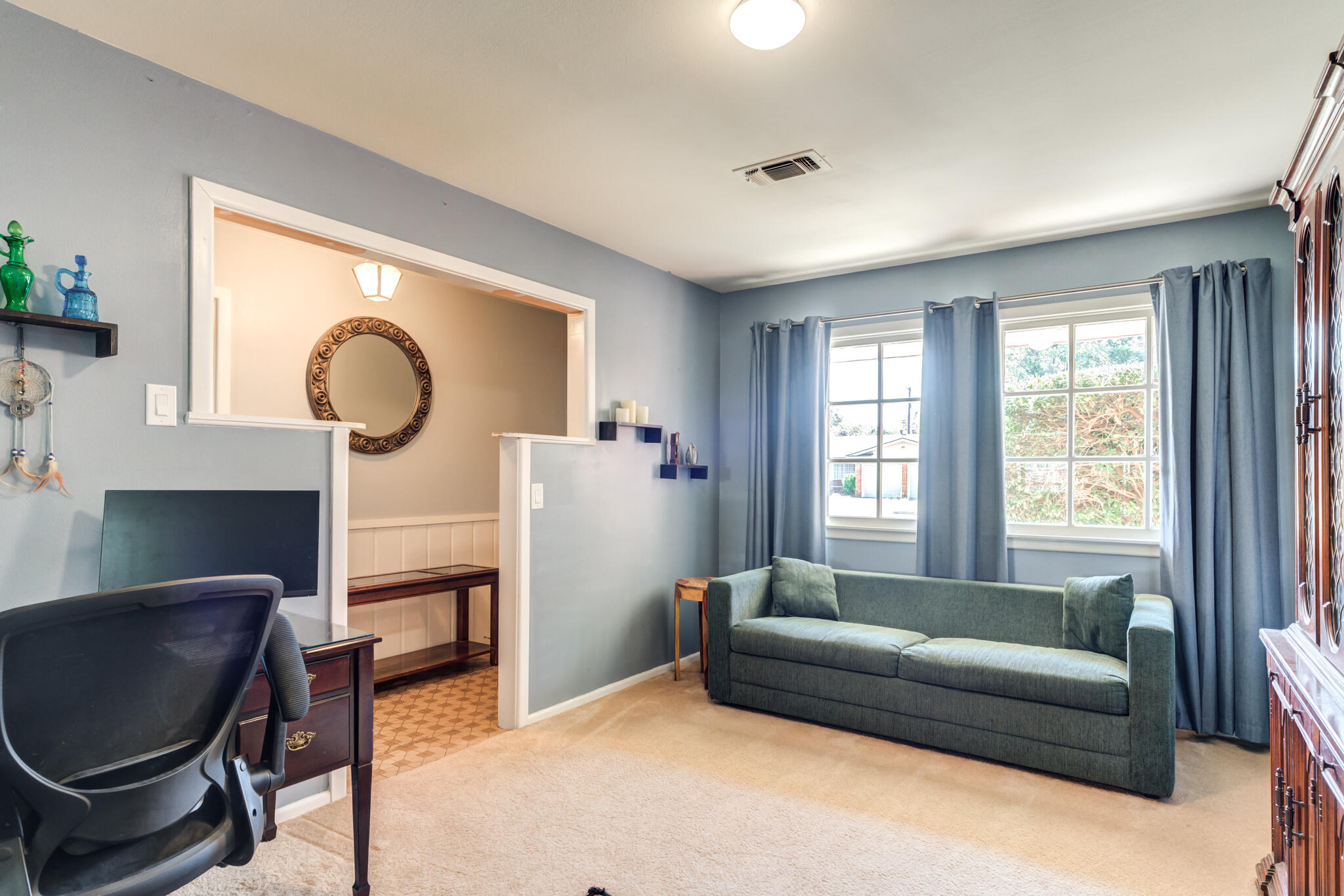2132 69th Street Lubbock, TX 79412 - Photo 10 of 38 a living room with furniture and a window
