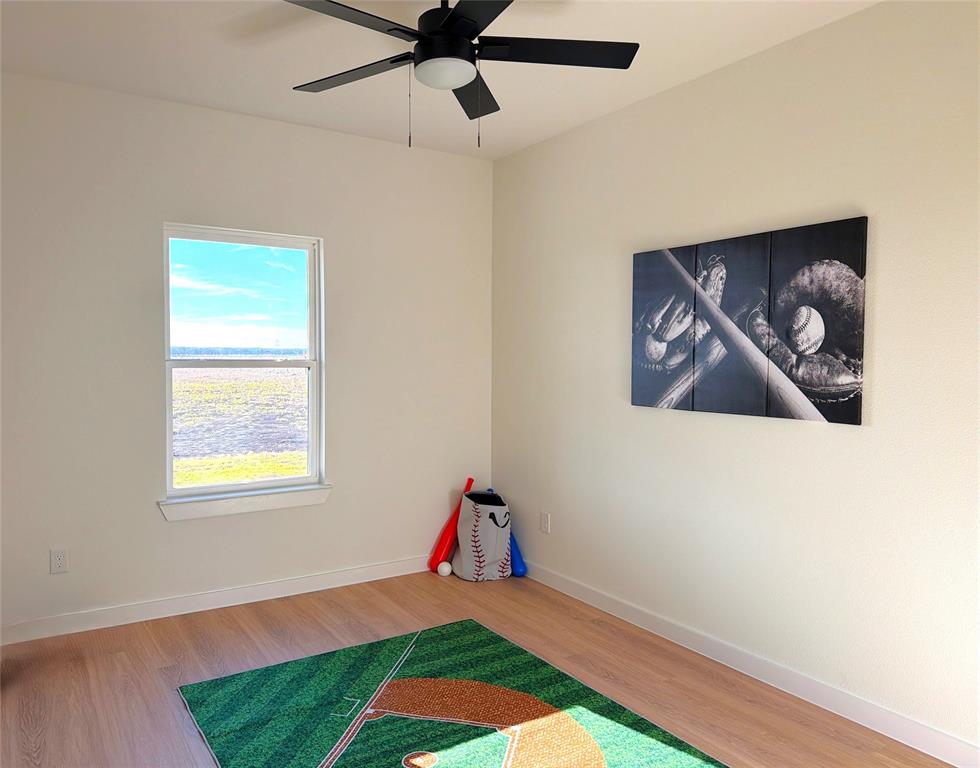 590 Anderson Rnch Road Waxahachie, TX 75167 - Photo 34 of 38 a view of an empty room with window and wooden floor