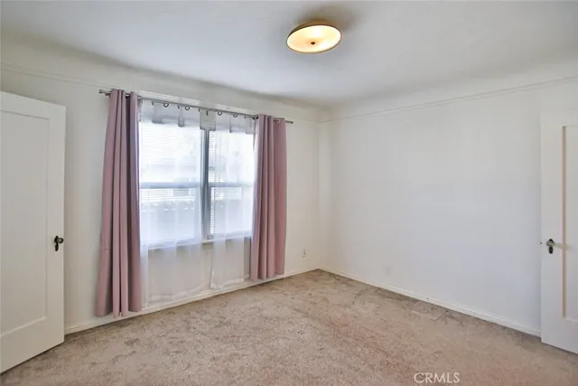 a view of walk in closet with window