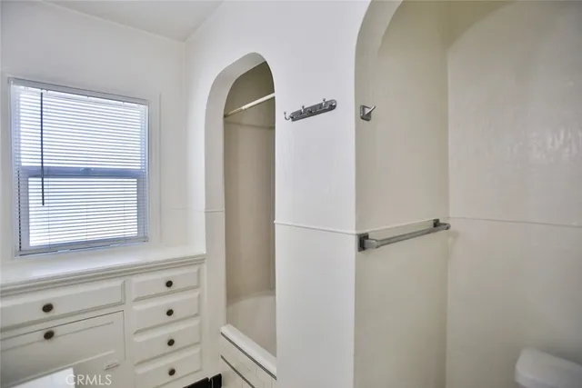 a kitchen with stainless steel appliances granite countertop a sink a stove and cabinets