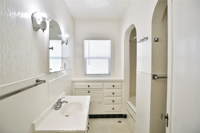 a view of a house with potted plants