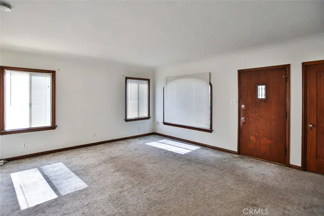 an empty room with closet area