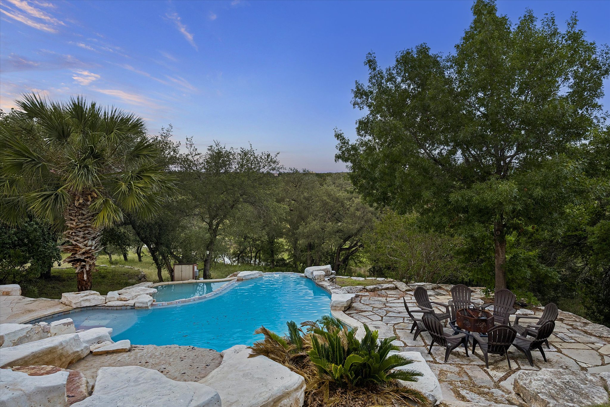 3719 Bee Creek Road Spicewood, TX 78669 - Photo 37 of 40 An inviting pool and patio area, ideal for relaxing under the open sky.