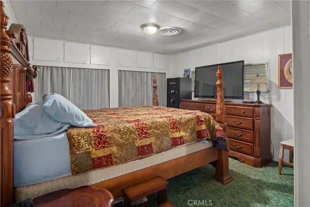 a bed room with a bed and furniture