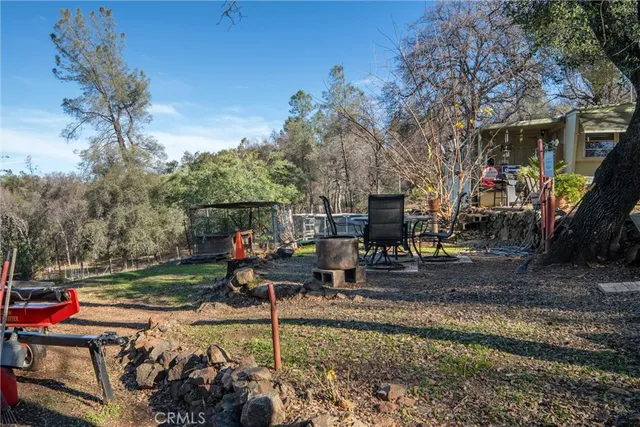 a view of a park with iron fence