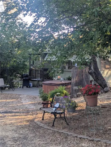 a view of a backyard with sitting area and furniture