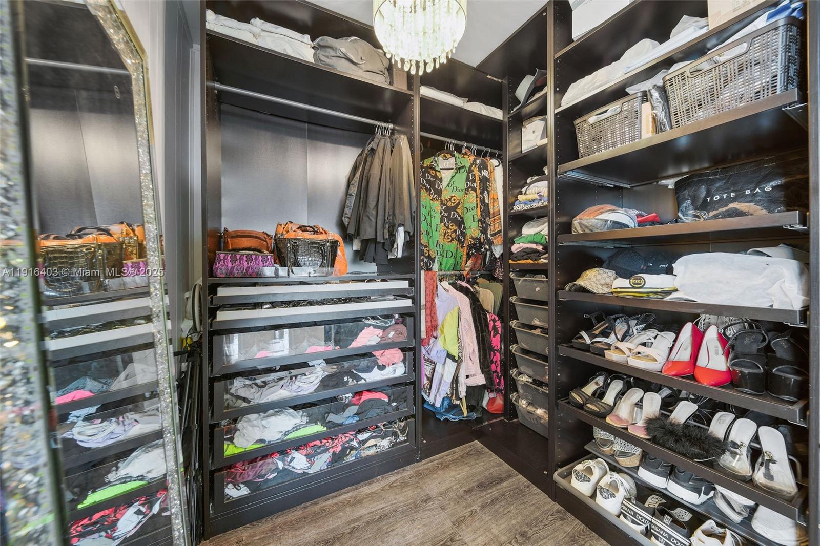 6061 Collins Avenue, Unit 5F Miami Beach, FL 33140 - Photo 19 of 26 a view of store room with racks