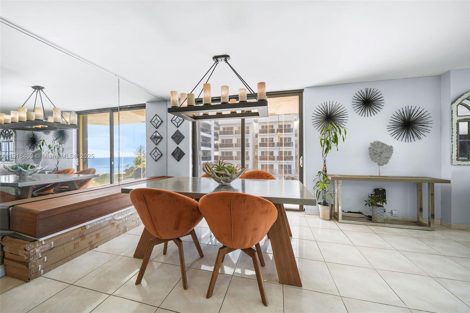 6061 Collins Avenue, Unit 5F Miami Beach, FL 33140 - Photo 6 of 26 a view of a dining room with furniture window and outside view