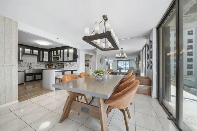 a kitchen with a table and chairs in it
