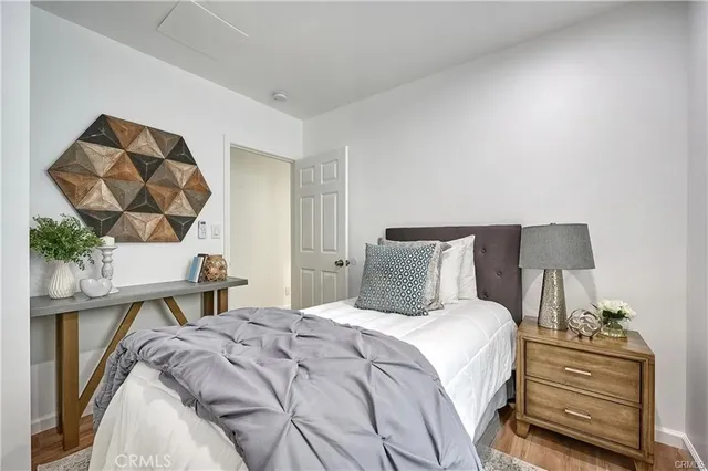 a bedroom with a bed and a mirror