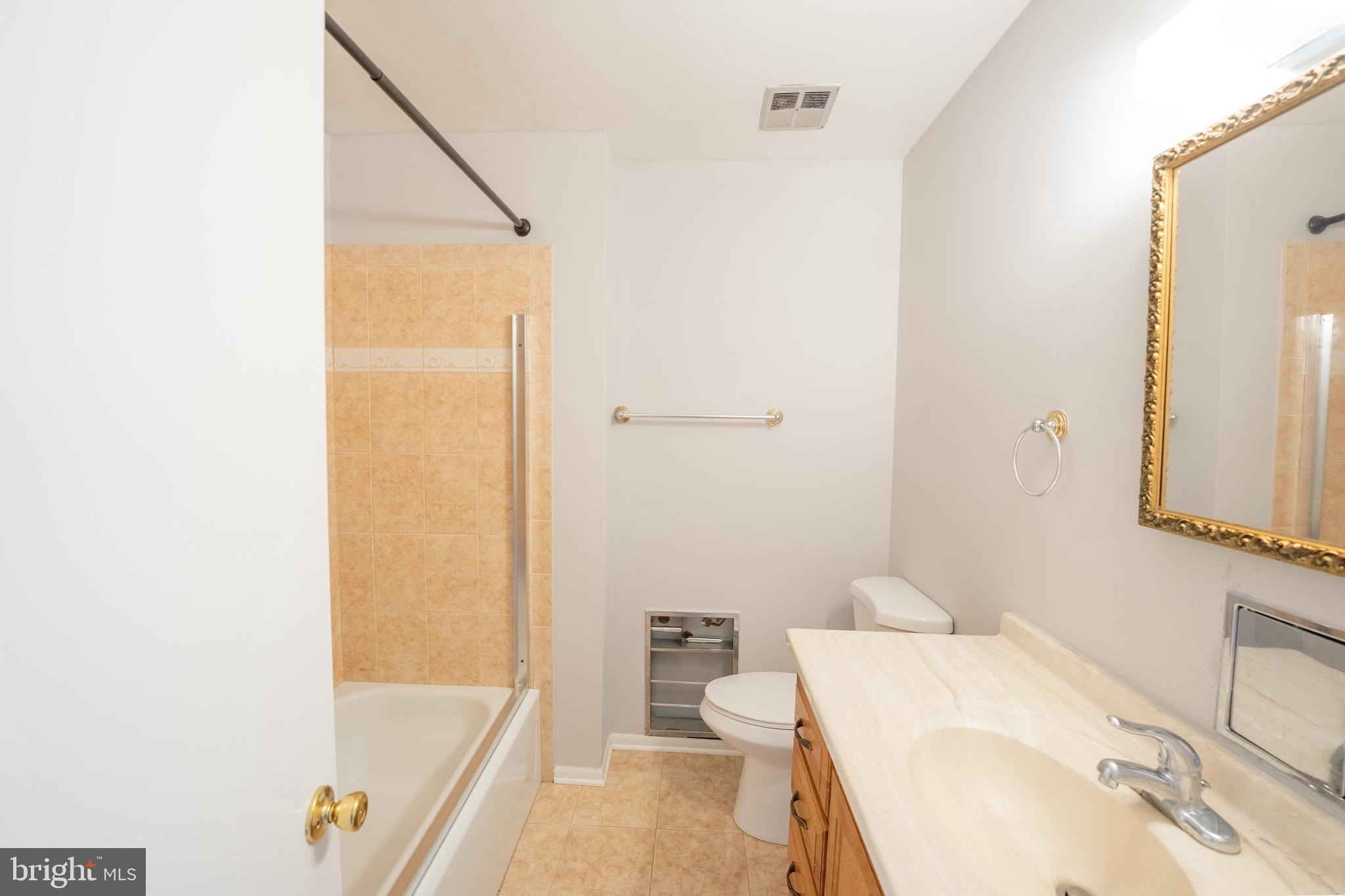10 Brian Court, Unit 242 Gaithersburg, MD 20877 - Photo 15 of 28 a bathroom with a sink and mirror with bathtub