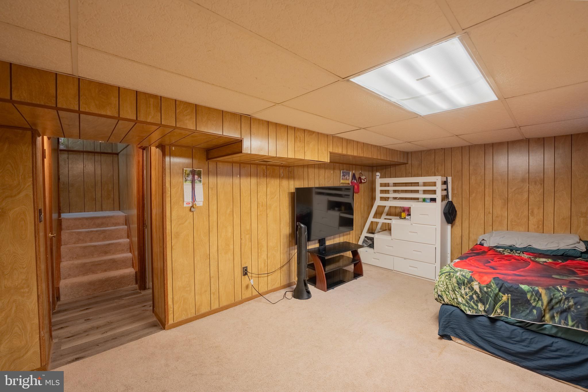 10 Brian Court, Unit 242 Gaithersburg, MD 20877 - Photo 23 of 28 a bedroom with furniture and large window