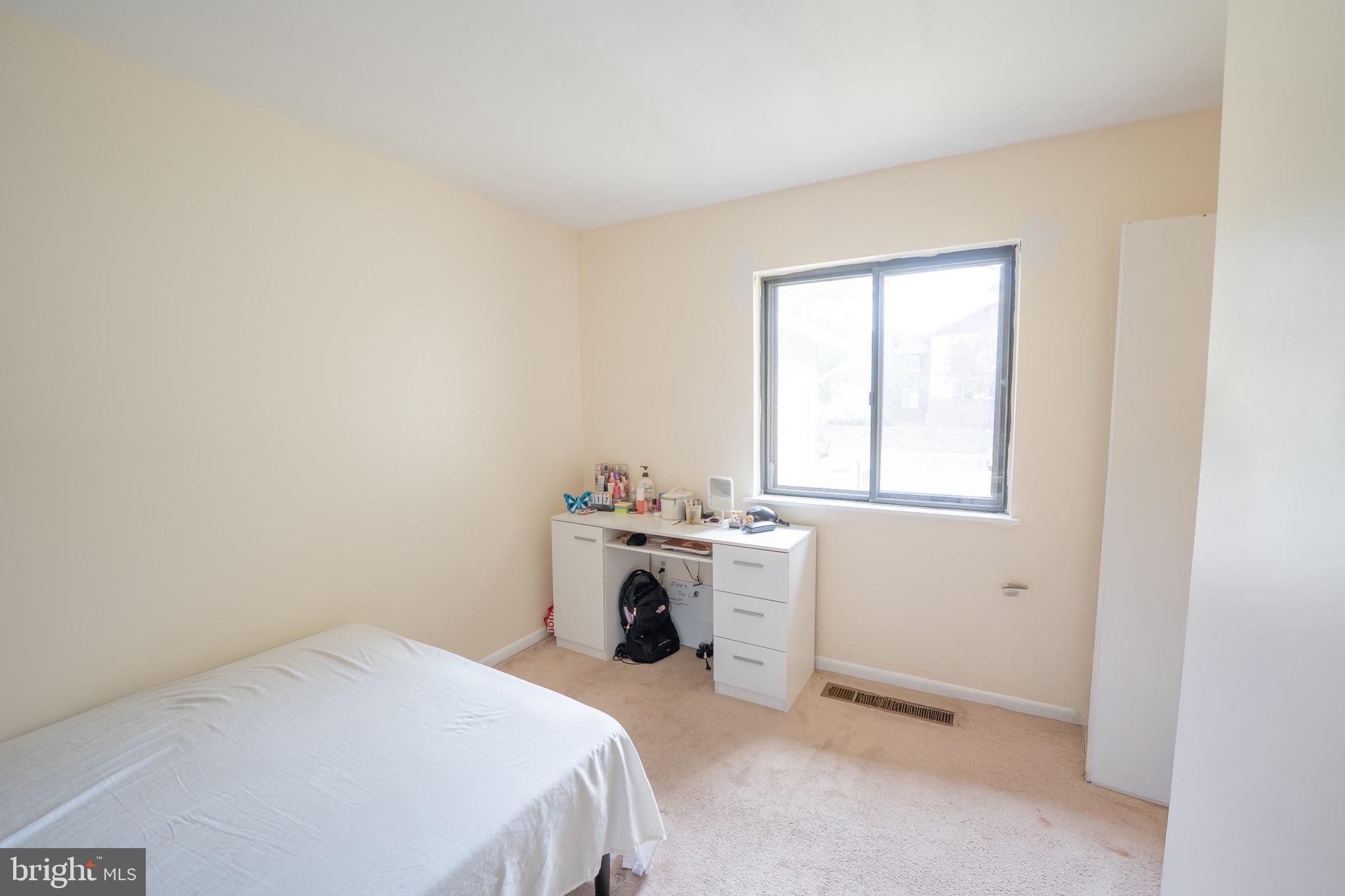 10 Brian Court, Unit 242 Gaithersburg, MD 20877 - Photo 28 of 28 a room with a bed and a window