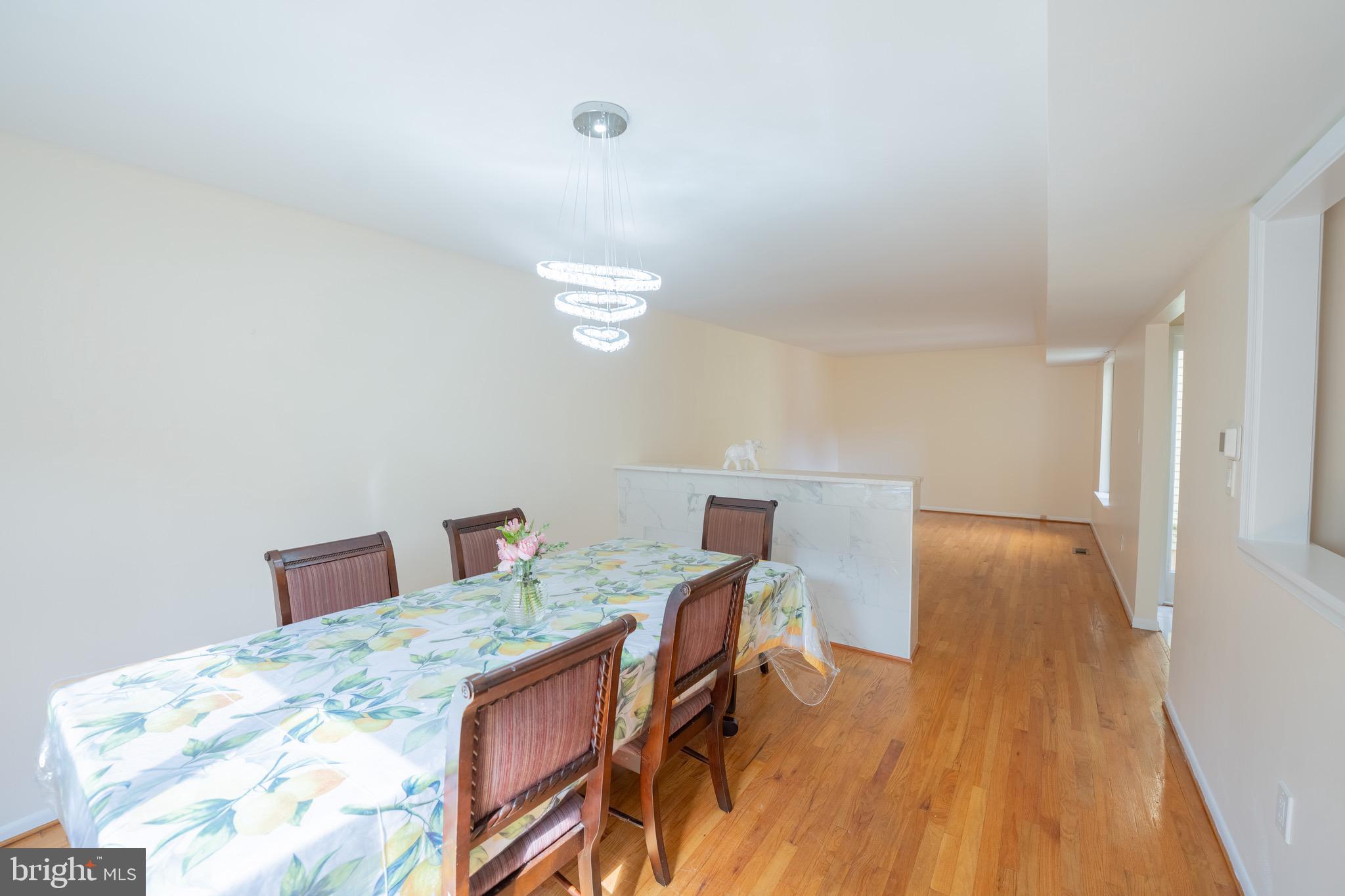 10 Brian Court, Unit 242 Gaithersburg, MD 20877 - Photo 6 of 28 a workspace with furniture and wooden floor