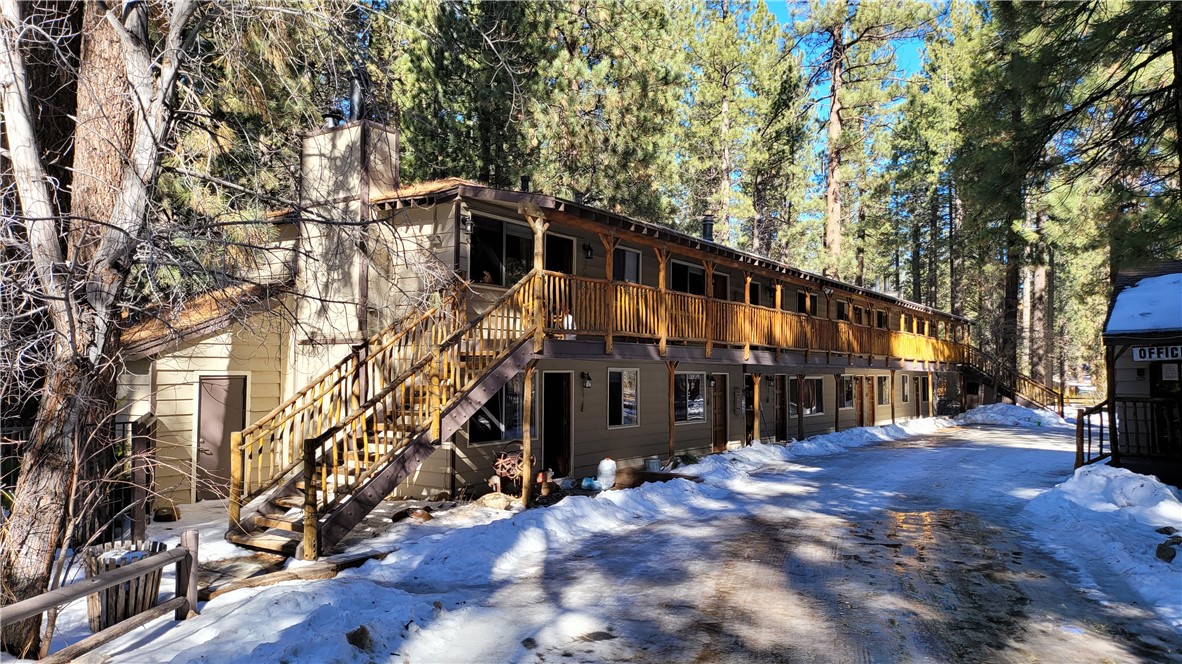 42268 Moonridge Road Big Bear Lake, CA 92315 - Photo 11 of 54 a view of a house with a large tree