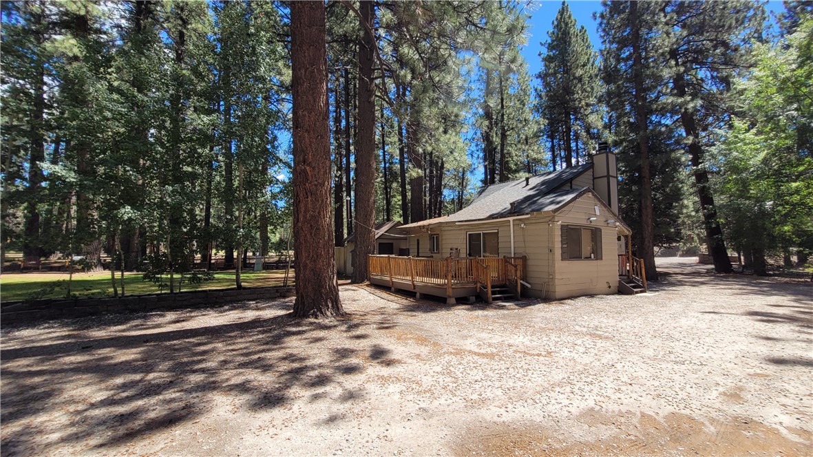 42268 Moonridge Road Big Bear Lake, CA 92315 - Photo 17 of 54 a view of a house with a yard covered in snow