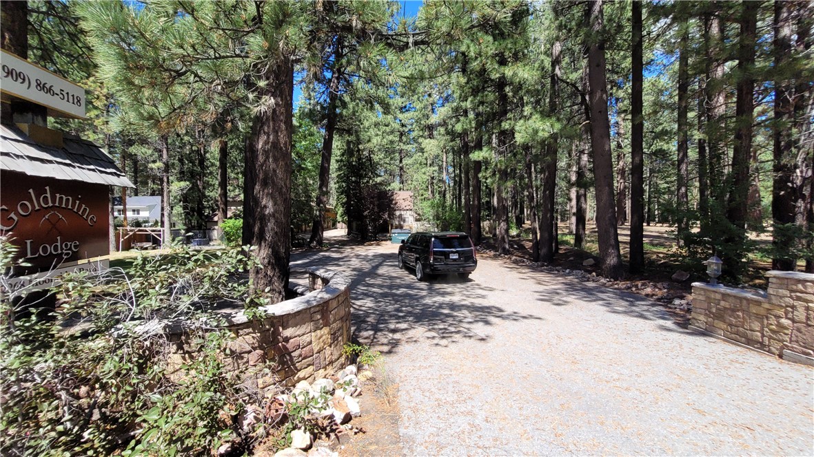 42268 Moonridge Road Big Bear Lake, CA 92315 - Photo 24 of 54 a view of outdoor space with deck and trees