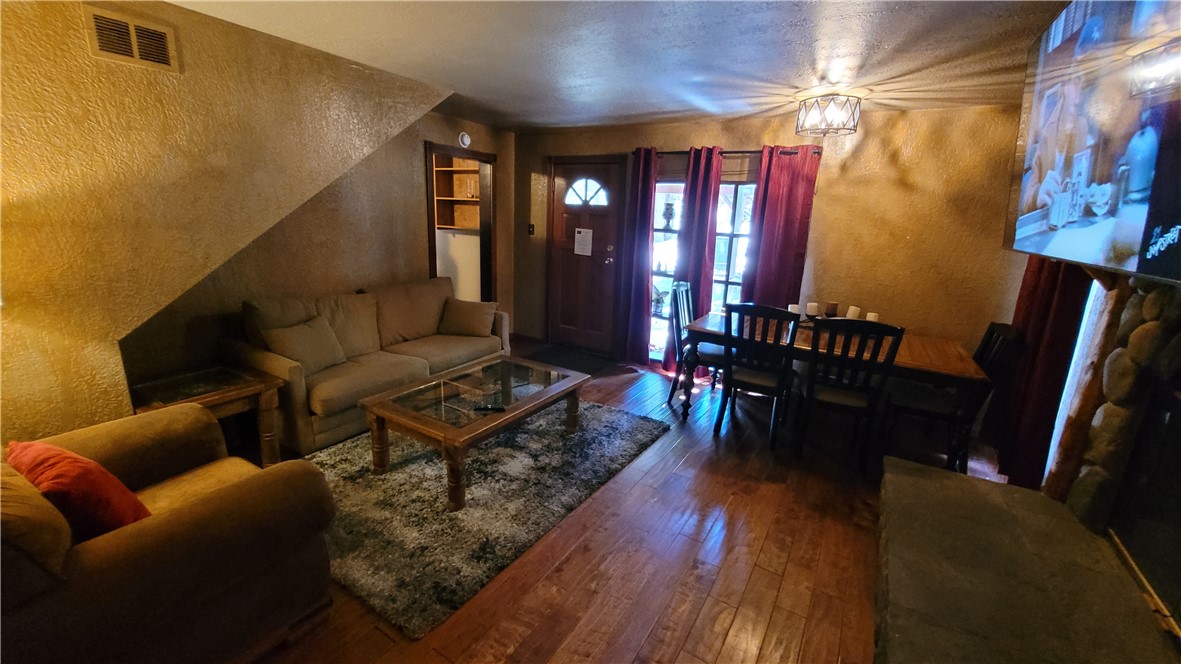 42268 Moonridge Road Big Bear Lake, CA 92315 - Photo 26 of 54 a living room with furniture and a piano