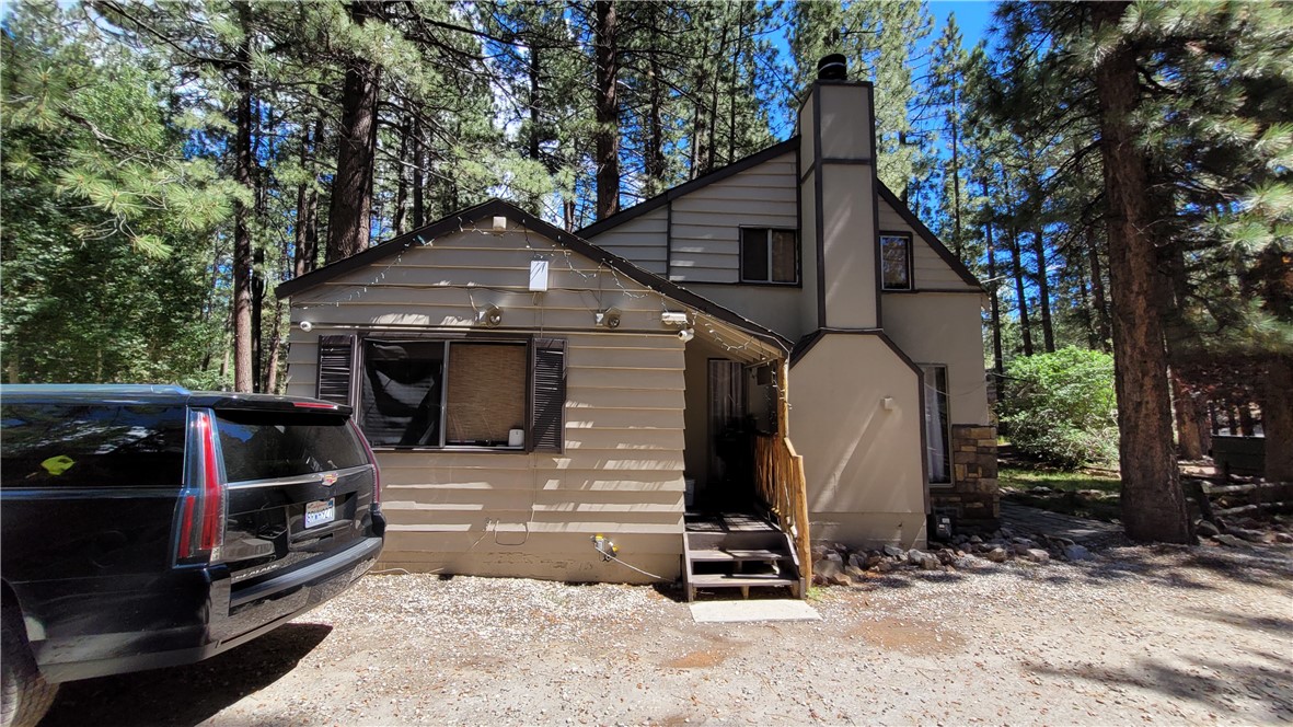 42268 Moonridge Road Big Bear Lake, CA 92315 - Photo 36 of 54 a front view of a house with parking space