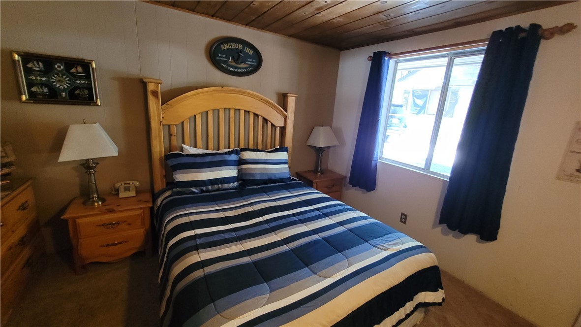 42268 Moonridge Road Big Bear Lake, CA 92315 - Photo 38 of 54 a bedroom with a bed and a window