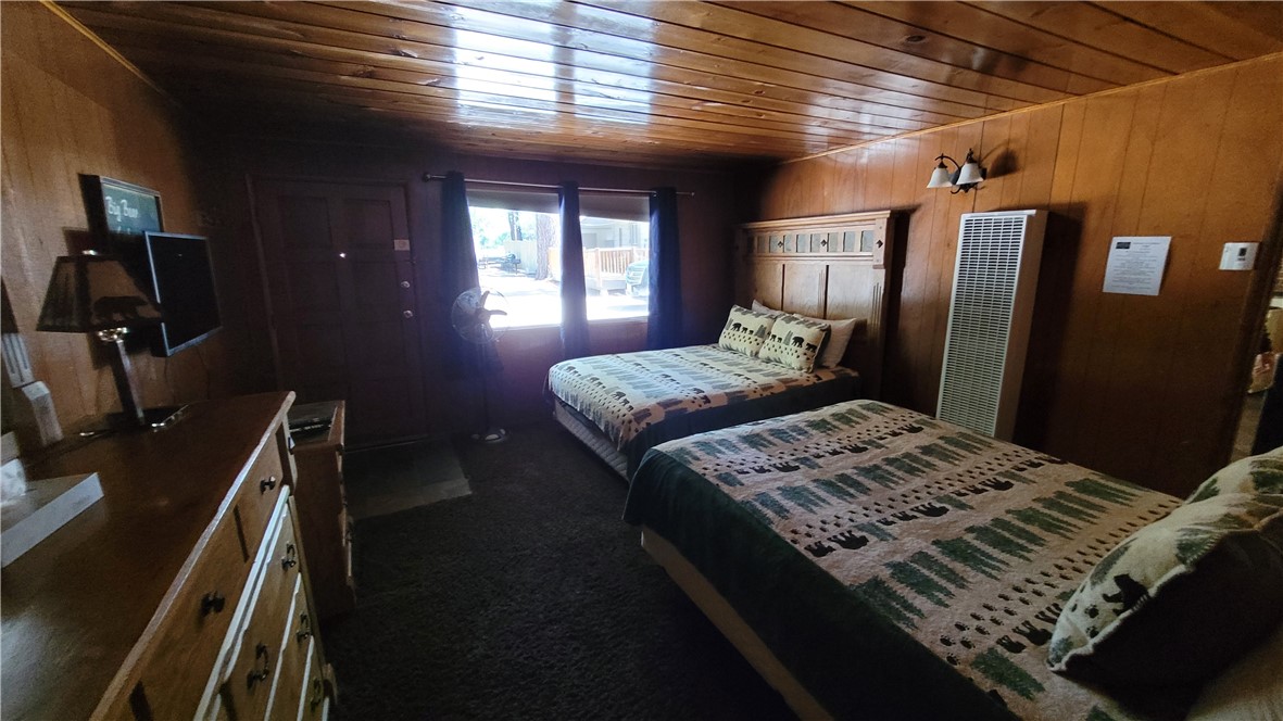 42268 Moonridge Road Big Bear Lake, CA 92315 - Photo 46 of 54 a bedroom with a bed next to a window