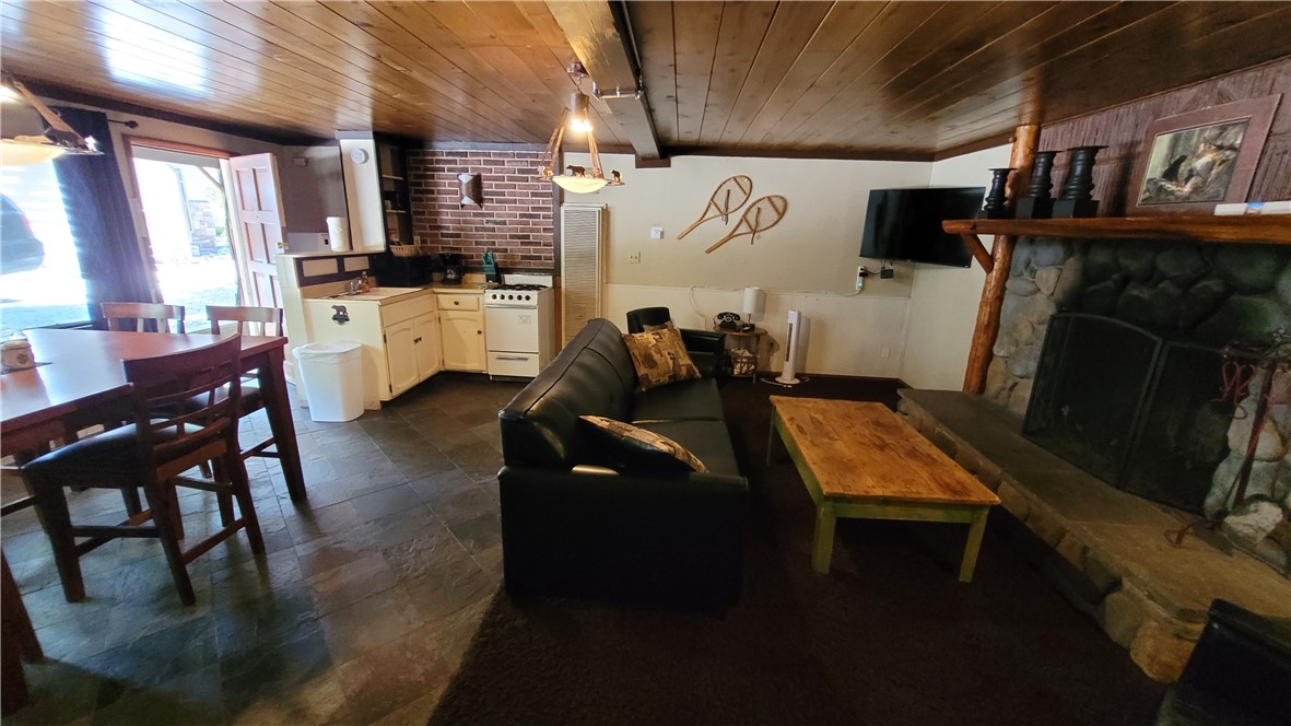 42268 Moonridge Road Big Bear Lake, CA 92315 - Photo 47 of 54 a kitchen with refrigerator and chairs