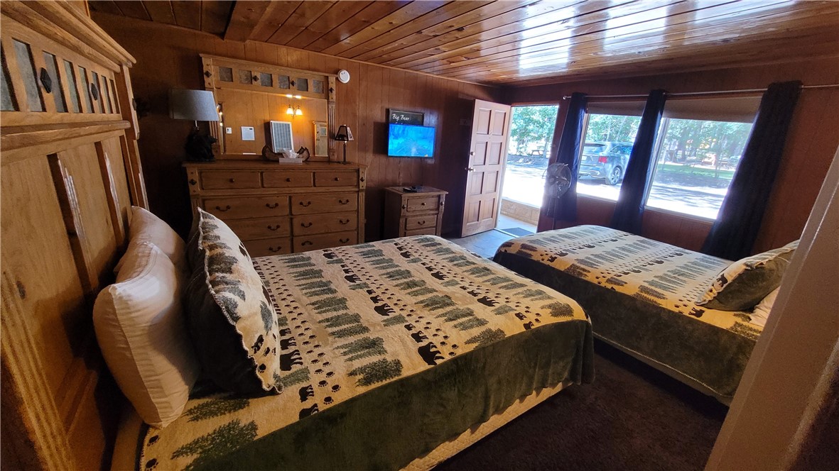 42268 Moonridge Road Big Bear Lake, CA 92315 - Photo 50 of 54 a bed sitting in a bedroom next to a window