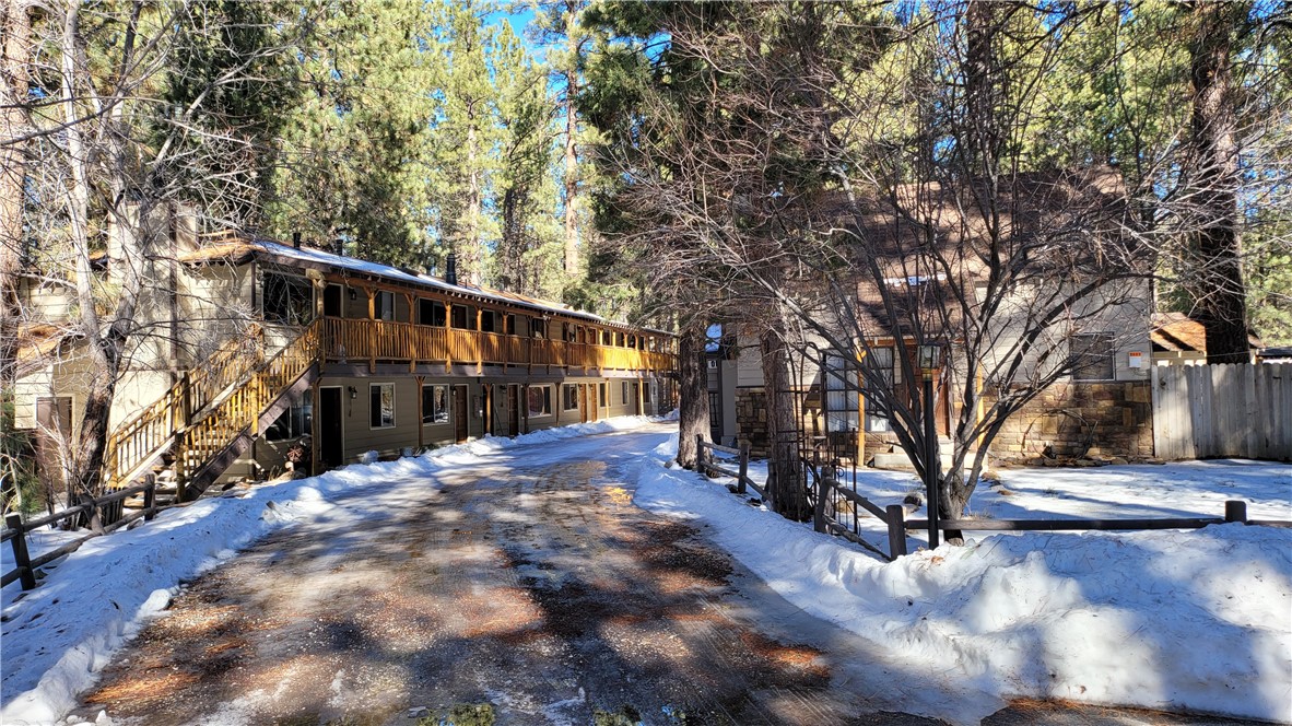 42268 Moonridge Road Big Bear Lake, CA 92315 - Photo 6 of 54 a view of road with large trees