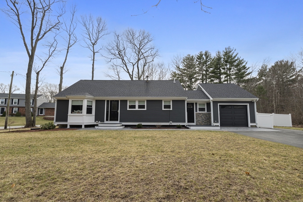 a house that has a tree in front of it